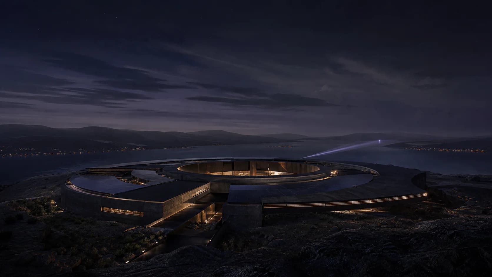 A monumental contemporary observatory watching a dark landscape at night